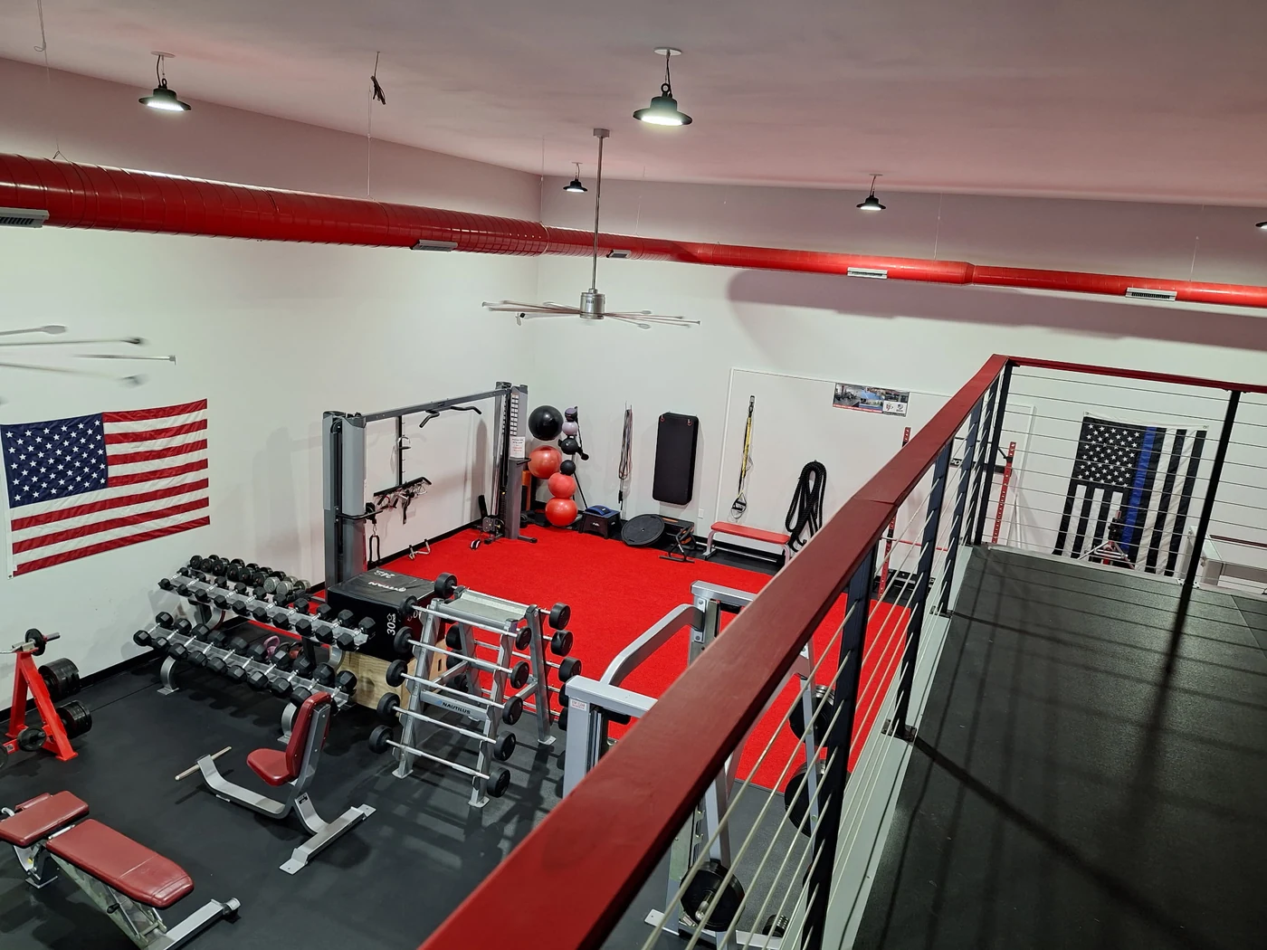 Modern open fitness and training space viewed from the mezzanine